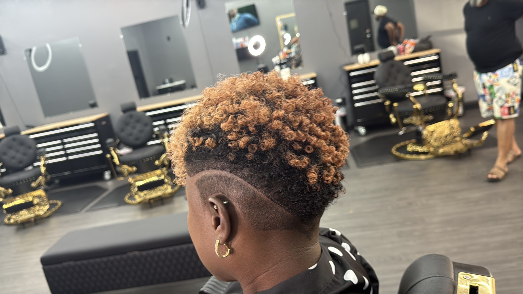 A textured cut with a sharp fade being finished at Alta Gama Barbershop